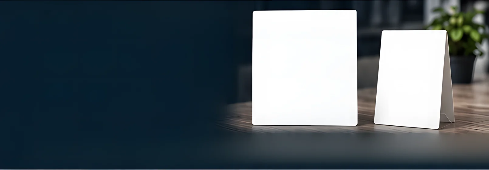 An invoice sheet and a scan-to-pay table tent standing on a wooden desk, a plant behind them